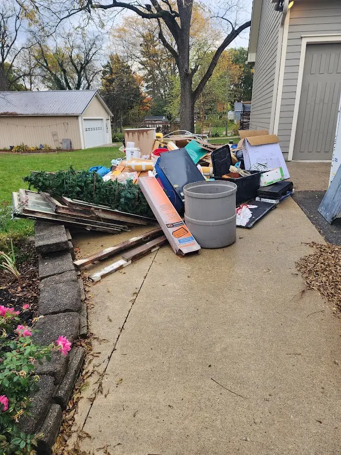 Dumpster being loaded with debris for 3 Yard Dumpster Rental in Burtonsville